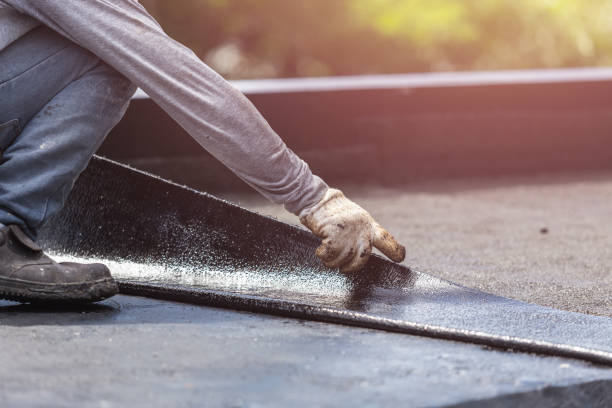 Professional Basement Waterproofing technician working in Ghent, KY